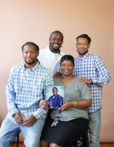 Pictured: Rickey's brothers (from left to right) Tyrell Rayford, Roderick Rayford, and James Boyd, with his mother, Roberta Rayford-Crawford