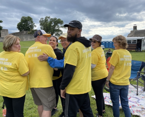 Group photo of a family at the Donate Life Legacy Walk wearing yellow t-shirts.