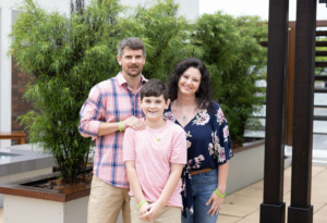 A professional portrait image of Chelsey Updike's stepfather, mother and younger brother.