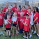 Group photo of a family at the Donate Life Legacy Walk in red t-shirts.