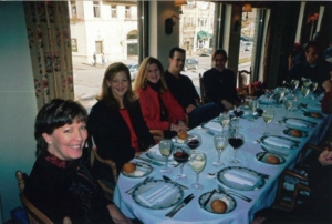 People sitting at a dinner table with drinks