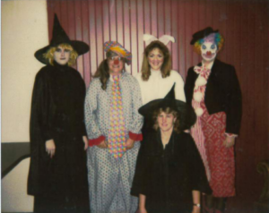 people wearing costumes posing for a photo