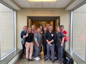 people posing in front of Russel D & Mary B Shelden Clinical Simulation Center