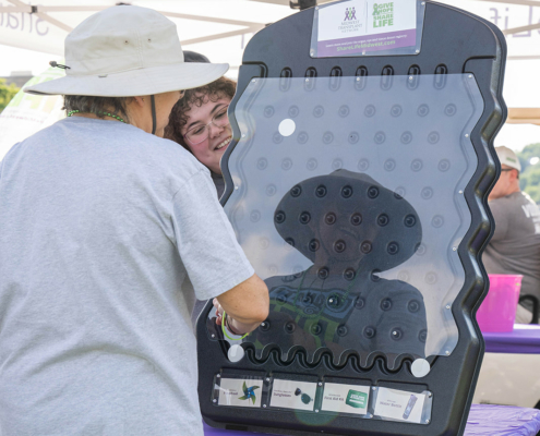 person playing a game under a tent