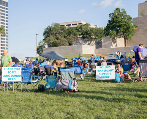 chairs and people in a field