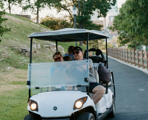 people in a golf cart