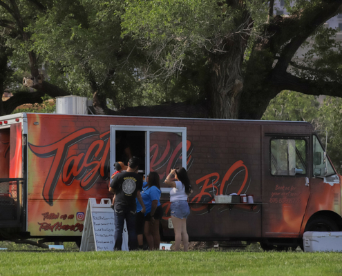 People standing in front of a food truck