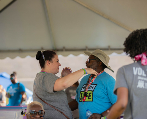 people about to hug in a tent