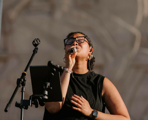 a musician singing into a microphone