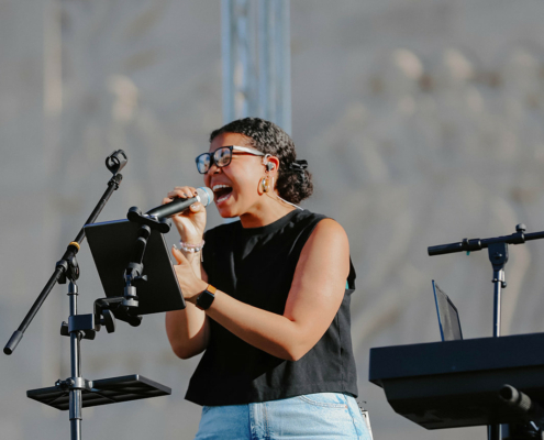 a musician singing into a microphone