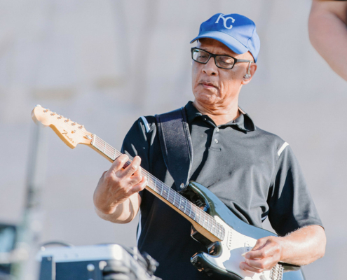 a musician playing a guitar