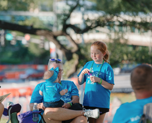 adults and children at an outdoor event