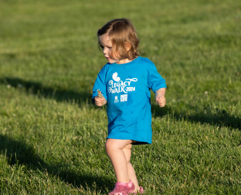 Child on a grass field