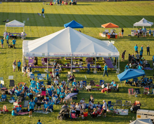 Bird's eye view of a field and tent that reads Welcome to the Legacy Walk!