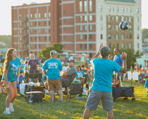 People throwing a ball outdoors