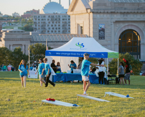 People playing cornhole